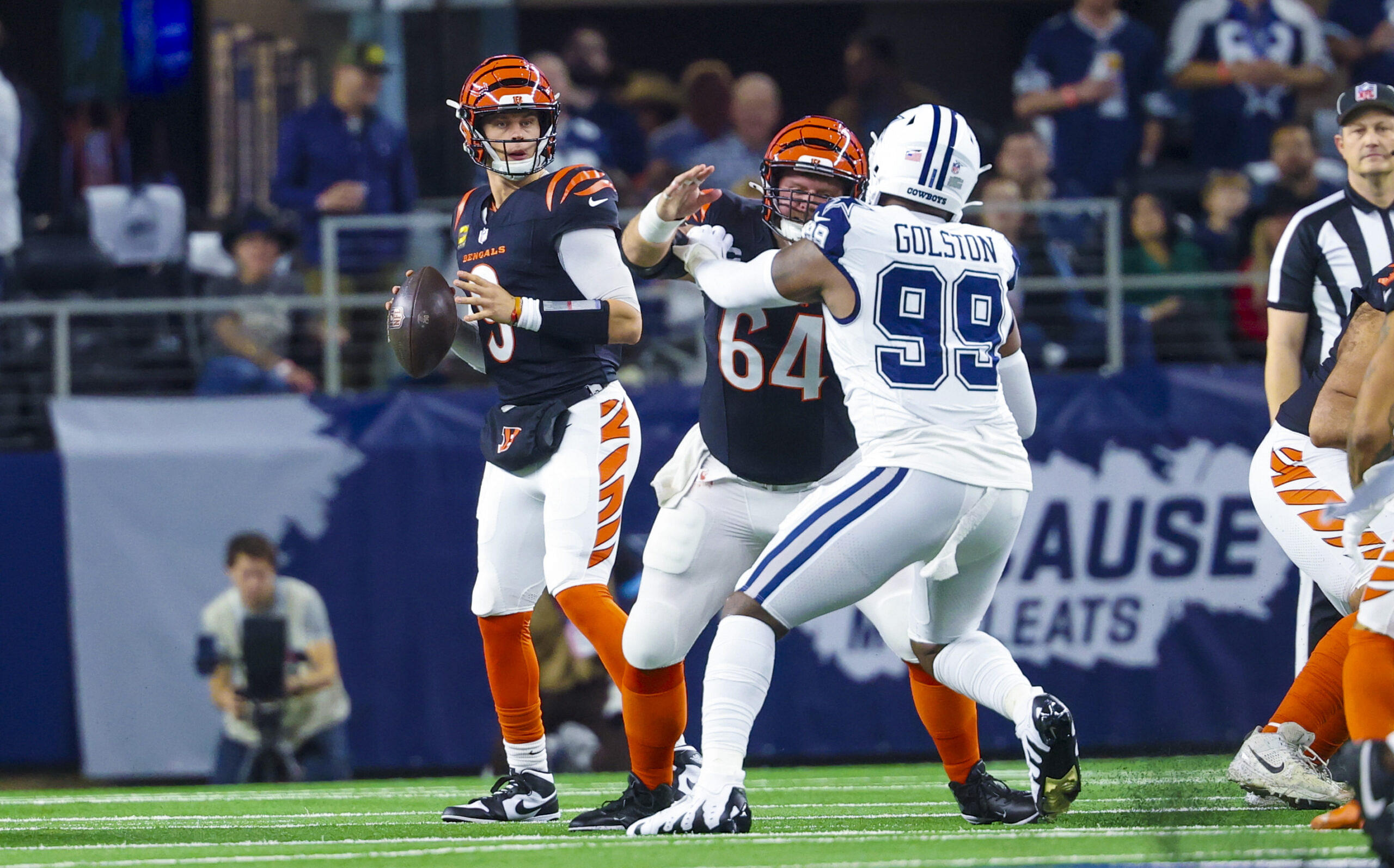 Dec 9, 2024; Arlington, Texas, USA; Cincinnati Bengals quarterback Joe Burrow (9) throws during the first quarter against the Dallas Cowboys at AT&T Stadium.