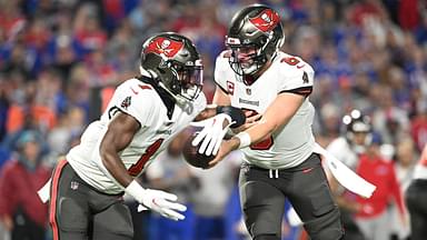 ampa Bay Buccaneers quarterback Baker Mayfield (6) hands the ball to running back Rachaad White (1) in the first quarter against the Buffalo Bills at Highmark Stadium.