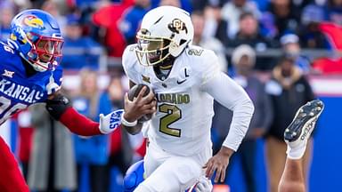 Nov 23, 2024; Kansas City, Missouri, USA; Colorado quarterback Shedeur Sanders (2) scrambles for yardage during the 2nd quarter between the Kansas Jayhawks and the Colorado Buffaloes at GEHA Field at Arrowhead Stadium.