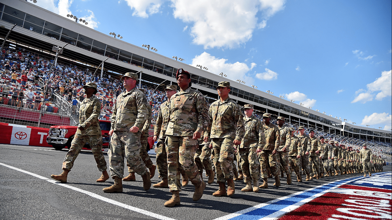 May 26, 2019; Concord, NC, USA; Service men and women of the U.S. Army March on the track prior to the Coca-Cola 600 at Charlotte Motor Speedway. Mandatory Credit: Jasen Vinlove-Imagn Images