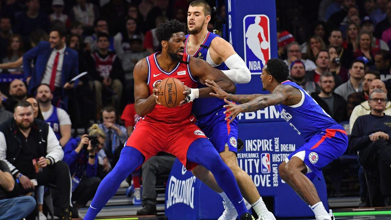 Lou Williams (R) and Joel Embiid (C)