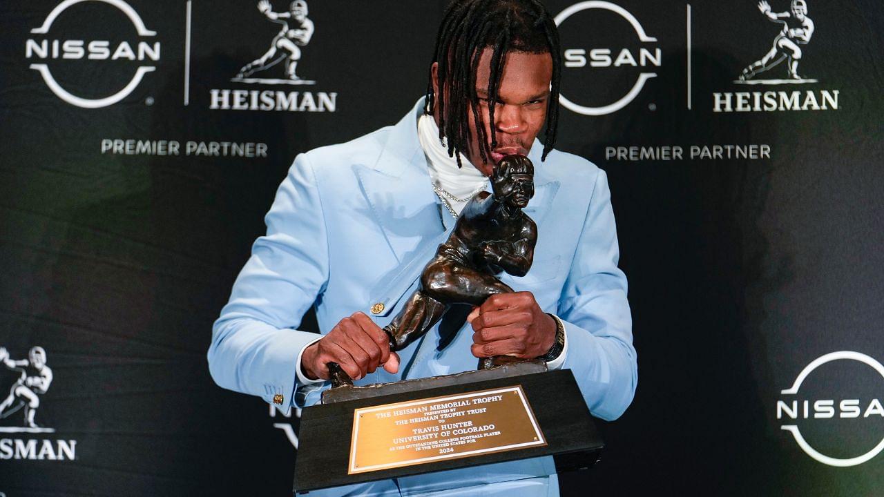 Colorado Buffaloes wide receiver/cornerback Travis Hunter poses for a photo after winning the Heisman Trophy award during the 2024 Heisman Trophy Presentation.