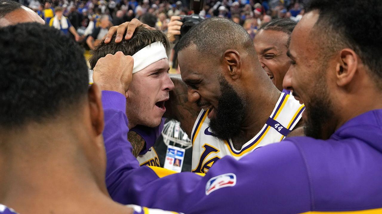 Los Angeles Lakers guard Austin Reaves (center left) is congratulated by forward LeBron James (center right) after making the game-winning basket to defeat the Golden State Warriors at Chase Center