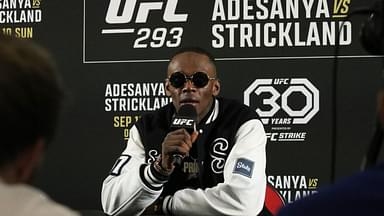 Israel Adesanya talks to the media after losing to Sean Strickland (not pictured) during UFC 293 at Qudos Bank Arena.