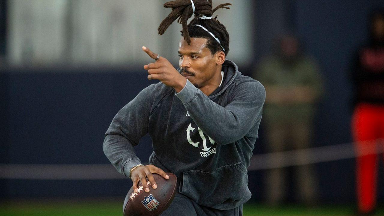 Former Auburn quarterback and NFL MVP Cam Newton runs a drill during Auburn Tigers Pro Day at Woltosz Football Performance Center in Auburn, Ala., on Tuesday, March 21, 2023.