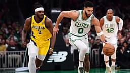 Boston Celtics forward Jayson Tatum (0) dribbles the ball up the court past Indiana Pacers forward Jarace Walker (5) during the first half at TD Garden.