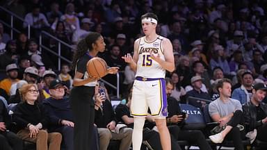 NBA female referee Danielle Scott (87) talks with Los Angeles Lakers guard Austin Reaves (15) in the second half against the Memphis Grizzlies at Crypto.com Arena.