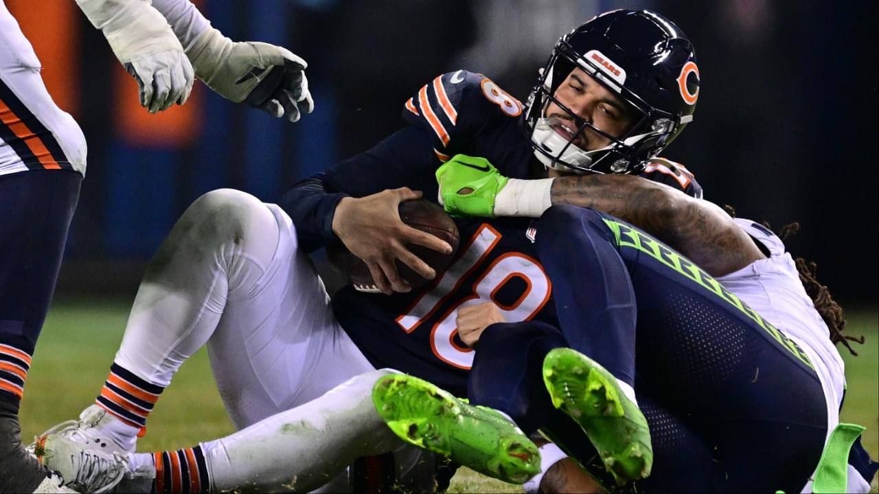 Chicago Bears quarterback Caleb Williams (18) is sacked by Seattle Seahawks defensive back Rayshawn Jenkins (2) during the fourth quarter at Soldier Field.