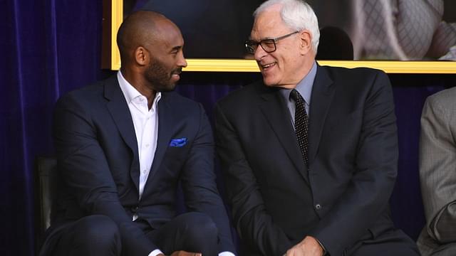 Kobe Bryant (left) and Phil Jackson react during ceremony to unveil statue of Los Angeles Lakers former center Shaquille O'Neal at Staples Center.