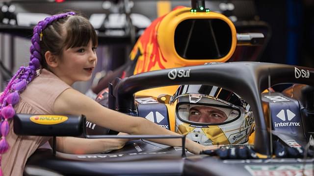 Max Verstappen of the Netherlands and Oracle Red Bull Racing and Penelope of Kelly Piquet™s daughter in the garage during Formula One Abu Dhabi Grand Prix