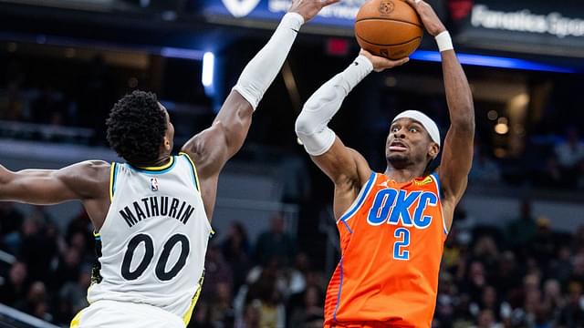 Oklahoma City Thunder guard Shai Gilgeous-Alexander (2) shoots the ball while Indiana Pacers guard Bennedict Mathurin (00) defends in the second half at Gainbridge Fieldhouse.