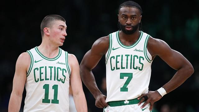 Boston Celtics forward Jaylen Brown (7) and Boston Celtics guard Payton Pritchard (11) talk during the first half against the Memphis Grizzlies at TD Garden.