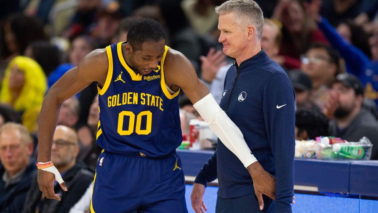 Golden State Warriors forward Jonathan Kuminga (00) reacts after a foul with head coach Steve Kerr against the Sacramento Kings during the second quarter at Chase Center.