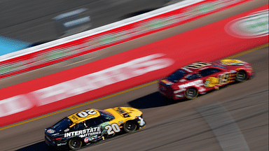 Driver Christopher Bell (20) drives for position against driver Martin Truex Jr. (19) during the Cup Series championship race at Phoenix Raceway.