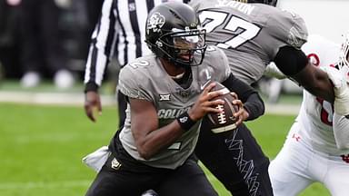 Nov 16, 2024; Boulder, Colorado, USA; Colorado Buffaloes quarterback Shedeur Sanders (2) carries the ball in the second half against the Utah Utes at Folsom Field.