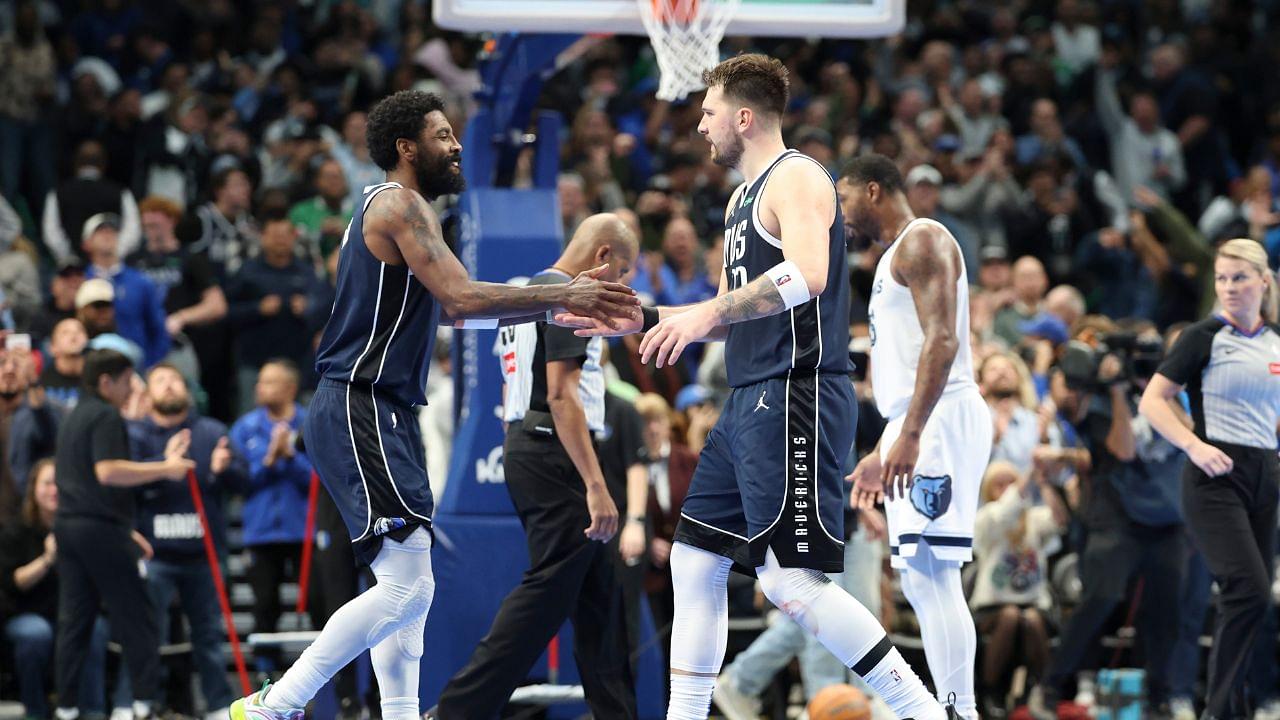 Dallas Mavericks guard Kyrie Irving (11) celebrates with Dallas Mavericks guard Luka Doncic (77) during the fourth quarter against the Memphis Grizzlies at American Airlines Center.