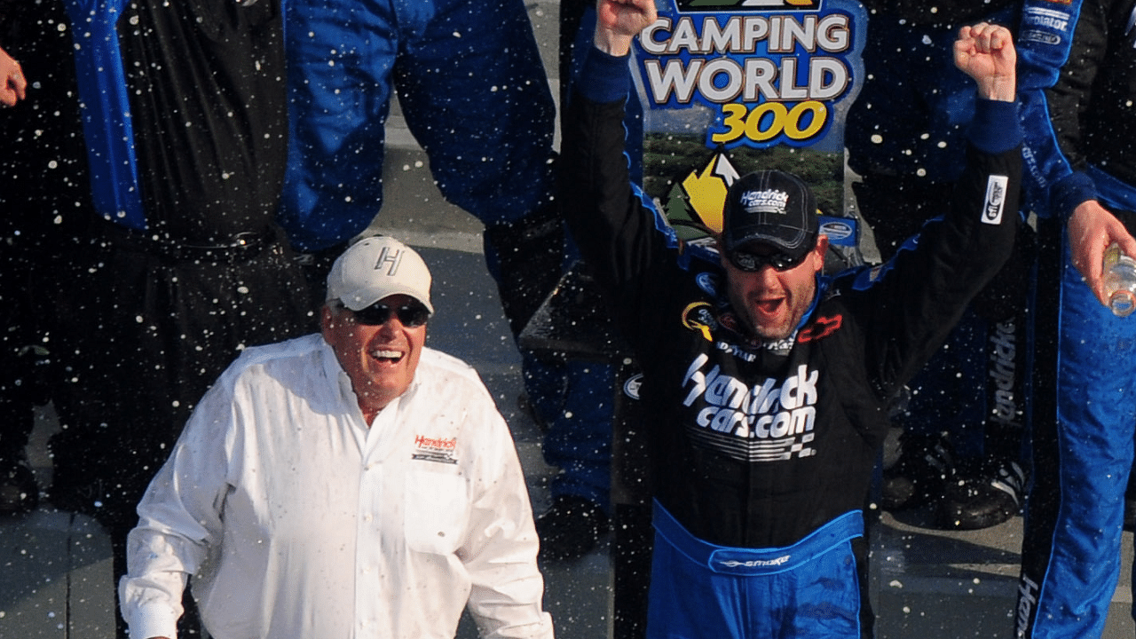 NASCAR Nationwide Series driver Tony Stewart celebrates as car owner Rick Hendrick looks on following the Camping World 300 at Daytona International Speedway.