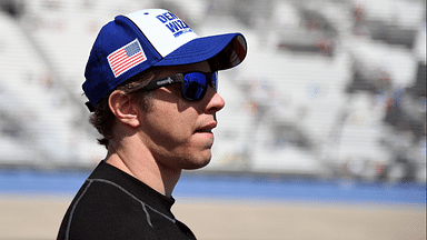 NASCAR Cup Series driver Brad Keselowski (2) waits beside his car before qualifying for the Ally 400 at Nashville Superspeedway.