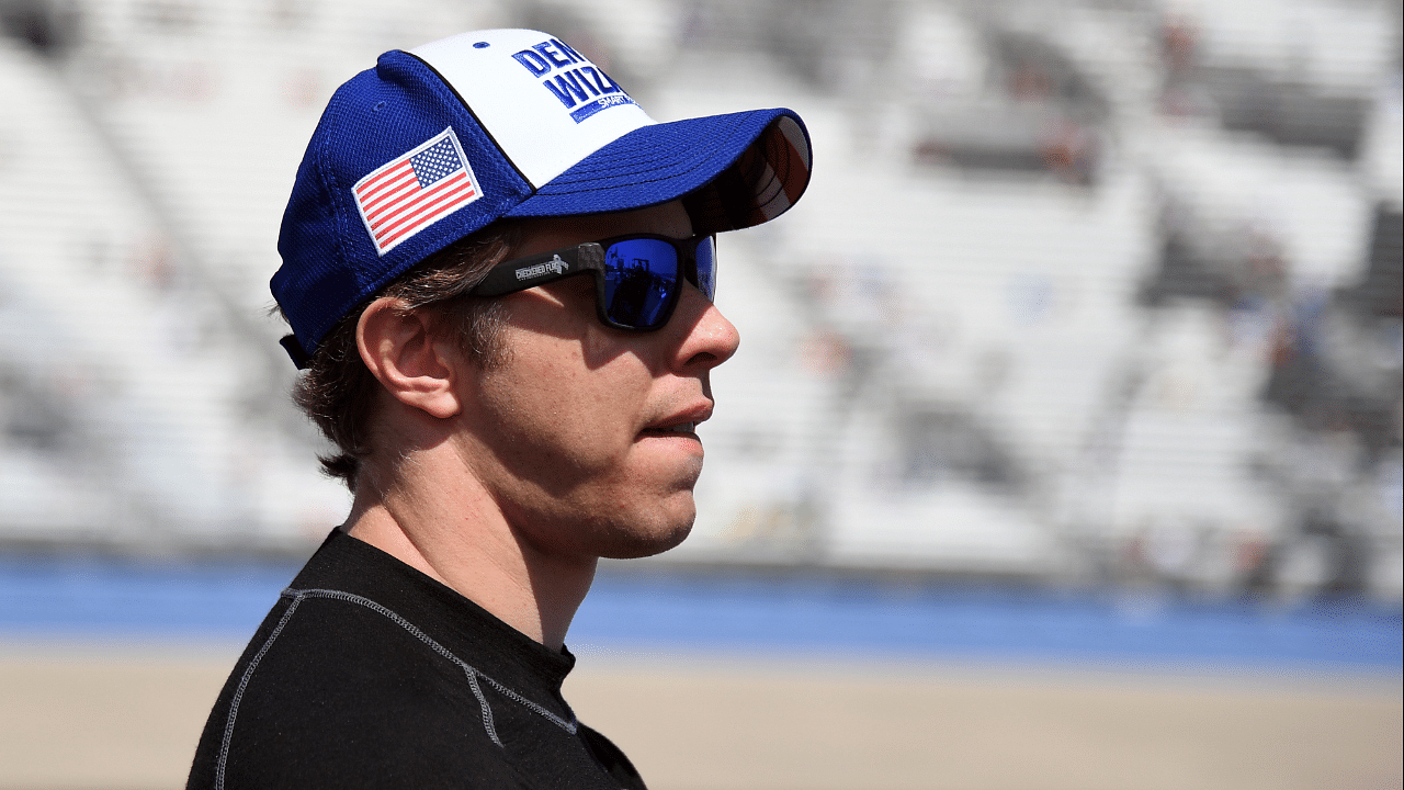 NASCAR Cup Series driver Brad Keselowski (2) waits beside his car before qualifying for the Ally 400 at Nashville Superspeedway.