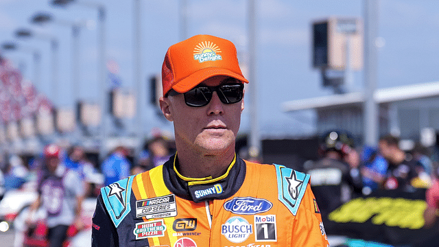 Kevin Harvick walks to his car for Cup practice at Darlington Raceway.