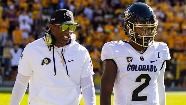 Colorado Buffaloes head coach Deion Sanders with son and quarterback Shedeur Sanders (2) against the Arizona State Sun Devils at Mountain America Stadium.