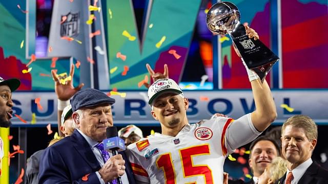 Kansas City Chiefs quarterback Patrick Mahomes (15) celebrates with the Vince Lombardi Trophy alongside Fox host Terry Bradshaw after defeating the Philadelphia Eagles during Super Bowl LVII at State Farm Stadium.