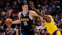 Denver Nuggets center Nikola Jokic (15) controls the ball under pressure from Los Angeles Lakers forward LeBron James (23) in the first quarter during game five of the first round for the 2024 NBA playoffs at Ball Arena.