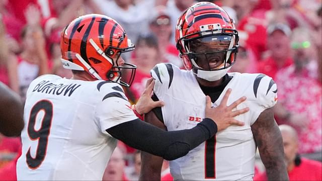 Cincinnati Bengals quarterback Joe Burrow (9) restrains wide receiver Ja'Marr Chase (1) after an altercation with officials during the second half of the game against the Kansas City Chiefs at GEHA Field at Arrowhead Stadium.