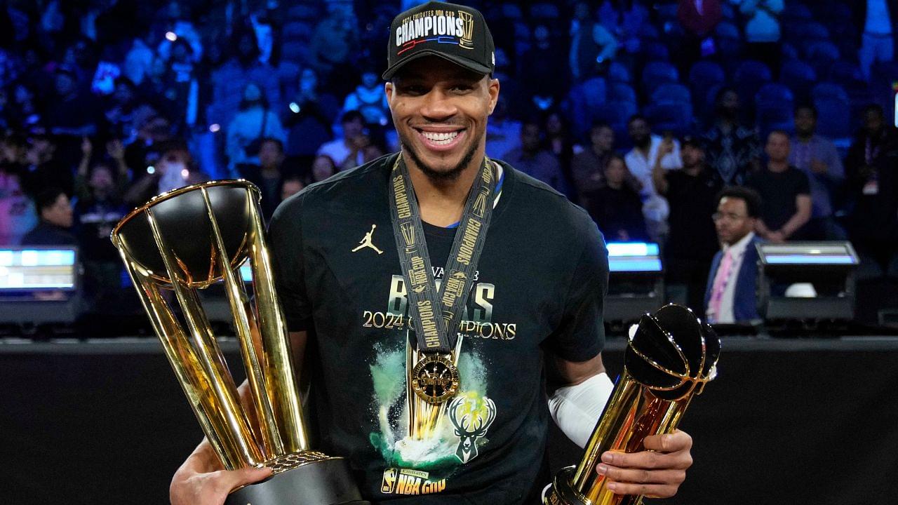 Milwaukee Bucks forward Giannis Antetokounmpo (34) celebrates with the most valuable player and championship trophies after winning the Emirates NBA Cup championship game against the Oklahoma City Thunder at T-Mobile Arena.