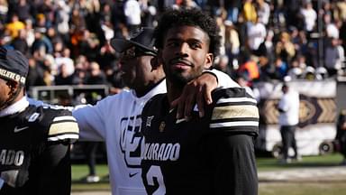 Colorado Buffaloes quarterback Shedeur Sanders (2) and head coach Deion Sanders ifollowing the win over the Oklahoma State Cowboys at Folsom Field.