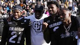 Colorado Buffaloes safety Shilo Sanders (21) and head coach Deion Sanders and quarterback Shedeur Sanders (2) and social media producer Deion Sanders Jr. following the win against the Oklahoma State Cowboys at Folsom Field.