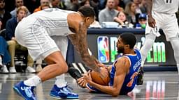 New York Knicks forward Mikal Bridges (25) and Dallas Mavericks forward P.J. Washington (25) battle for control of the ball during the first quarter against the Dallas Mavericks at the American Airlines Center.