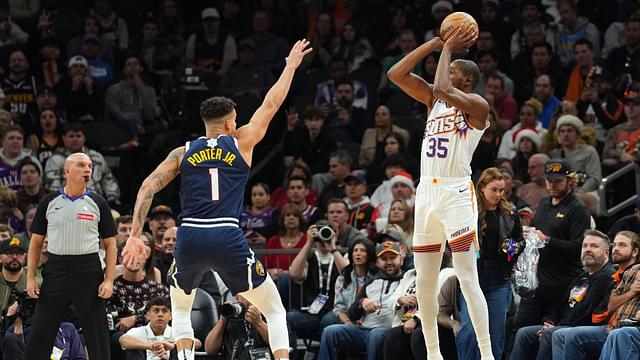 Phoenix Suns forward Kevin Durant (35) shoots over Denver Nuggets forward Michael Porter Jr. (1) during the second half at Footprint Center.