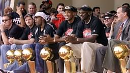 Chicago Bulls with their six championship trophies. Left to right in the front row are Luc Longley, Toni Kukoc, Ron Harper, Dennis Rodman (leaning back), Scottie Pippen, Michael Jordan and Chicago Mayor Richard Daley at a championship rally at Grant Park in Chicago.