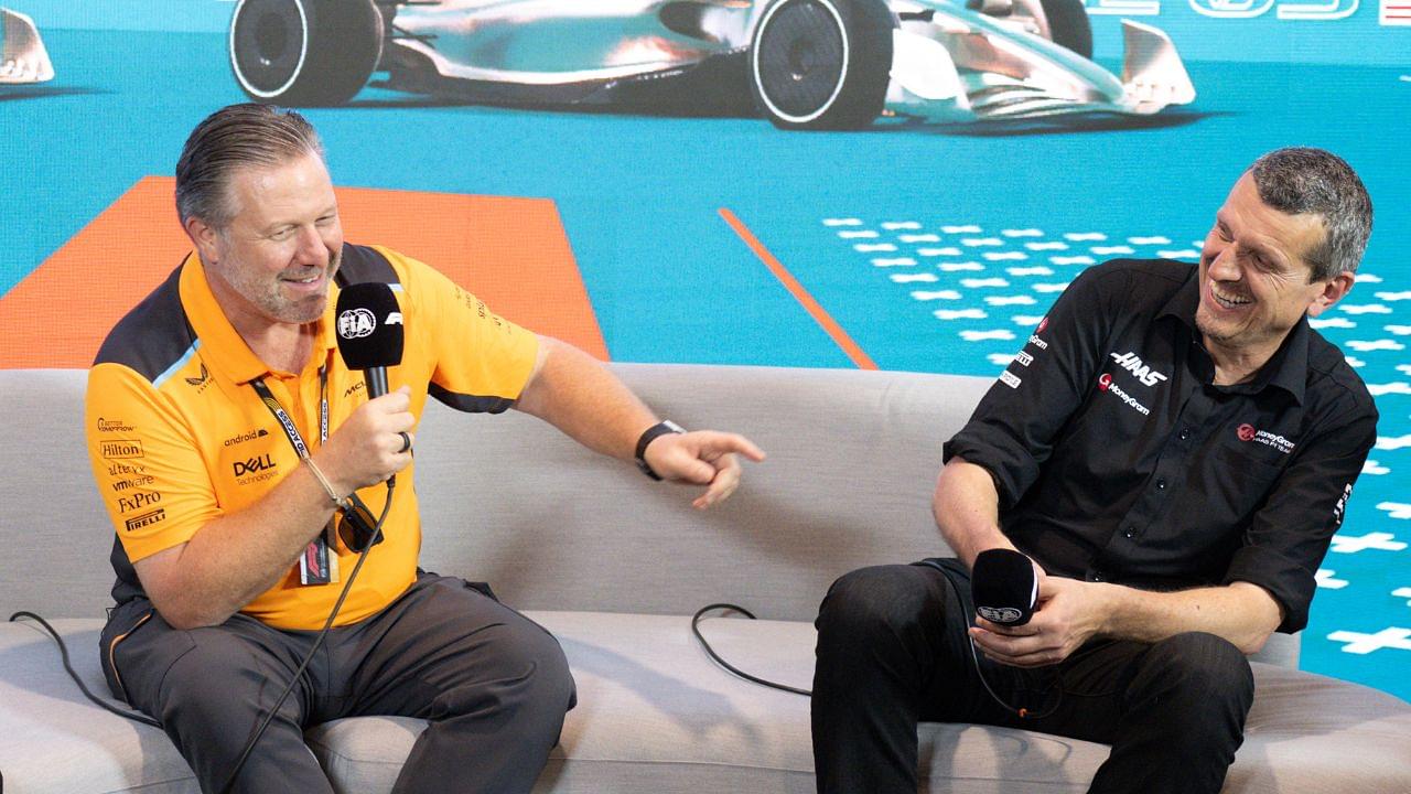 McLaren Chief Executive Officer Zak Brown and Haas team principal Guenther Steiner laugh as they talk with the media during a press conference