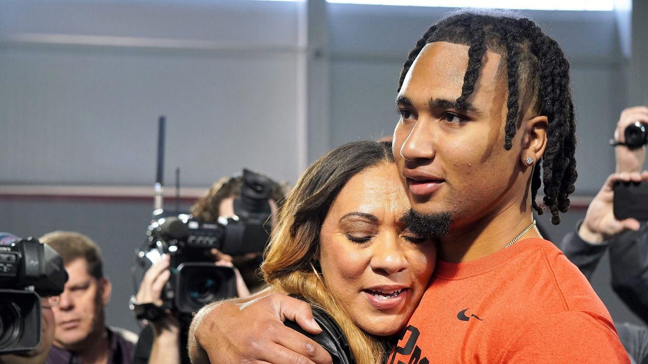 Ohio State quarterback C.J. Stroud hugs his mother, Kim, after his workout on the Buckeyes' pro day. CJ Stroud