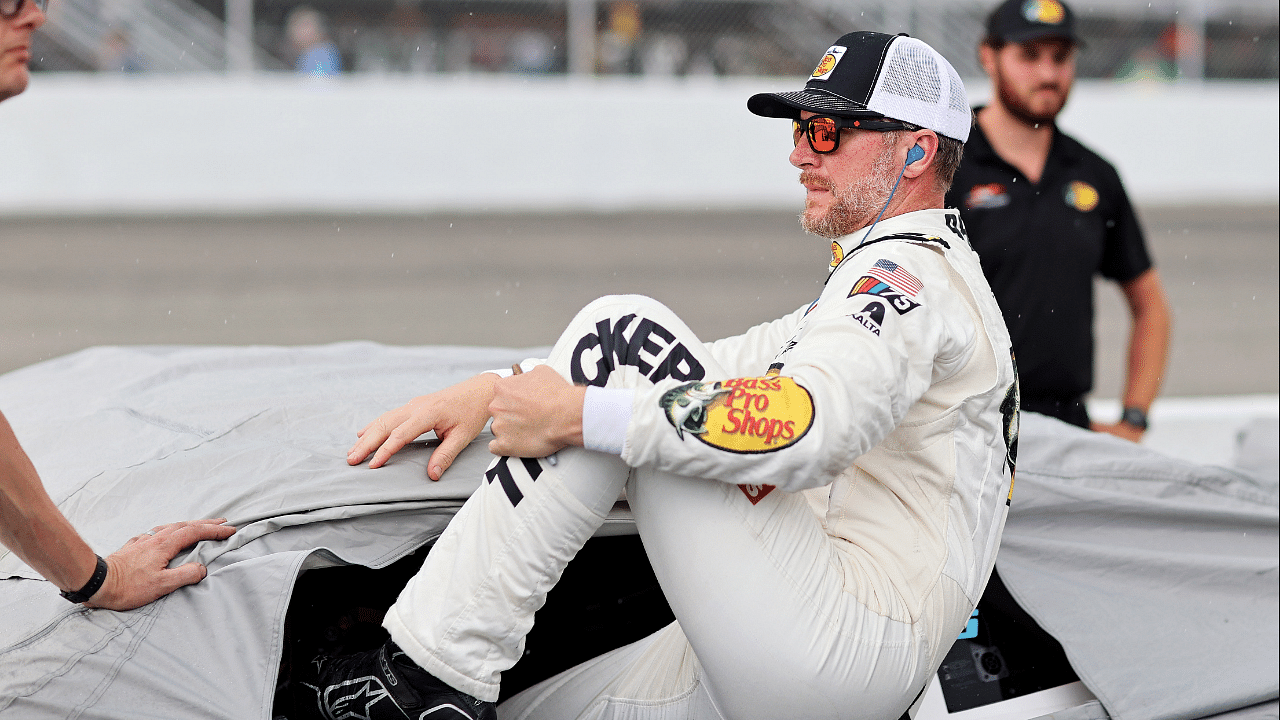 Dale Earnhardt Jr. gets out of his car for a rain delay in qualifying for the 16th Annual Hampton Heat at Langley Speedway.