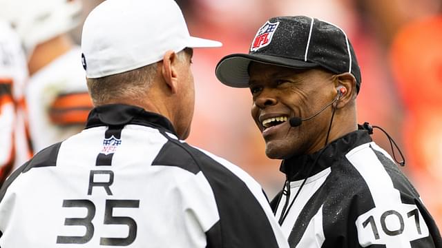 Oct 15, 2023; Cleveland, Ohio, USA; NFL line judge Carl Johnson (101) talks with referee John Hussey (35) during the second quarter between the Cleveland Browns and the San Francisco 49ers at Cleveland Browns Stadium.