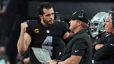 Sep 13, 2021; Paradise, Nevada, USA; Las Vegas Raiders quarterback Derek Carr (4) speaks with head coach Jon Gruden during the second half at Allegiant Stadium.