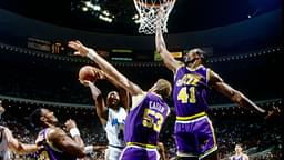 Utah Jazz center Mark Eaton (53) and Thurl Bailey (41) defend a shot by Orlando Magic forward Michael Ansley (45) at the Orlando Arena.