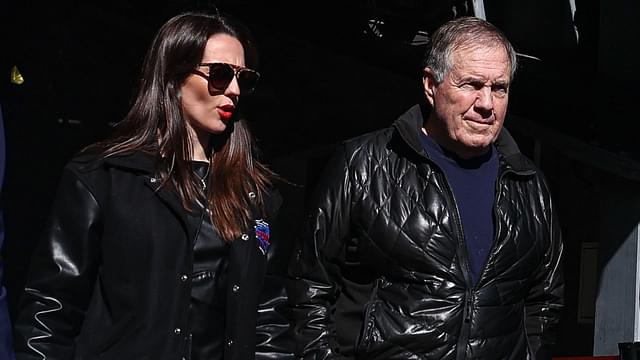 Former New England Patriots head coach Bill Belichick and girlfriend Jordon Hudson enter the field before the game between the Notre Dame Fighting Irish and the Navy Midshipmen at MetLife Stadium.