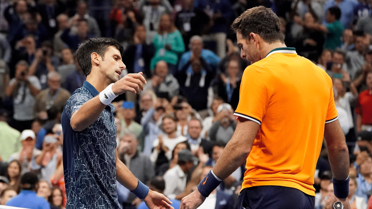 Novak Djokovic of Serbia (left) greets Juan Martin del Potro of Argentina after the men's final on day fourteen of the 2018 U.S. Open