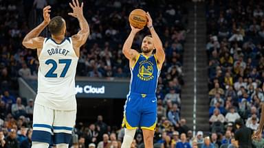 Golden State Warriors guard Stephen Curry (30) shoots a three point shot against Minnesota Timberwolves center Rudy Gobert (27) during the fourth quarter at Chase Center.