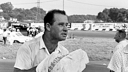 An exhausted Nelson Stacy wipes his parched lips with a towel as he rests on the guard rail at the Fairgrounds Speedway on May 17, 1964. Stacy pushed himself and his 1964 Ford to the limit in finishing second in the 300-lap ARCA race.