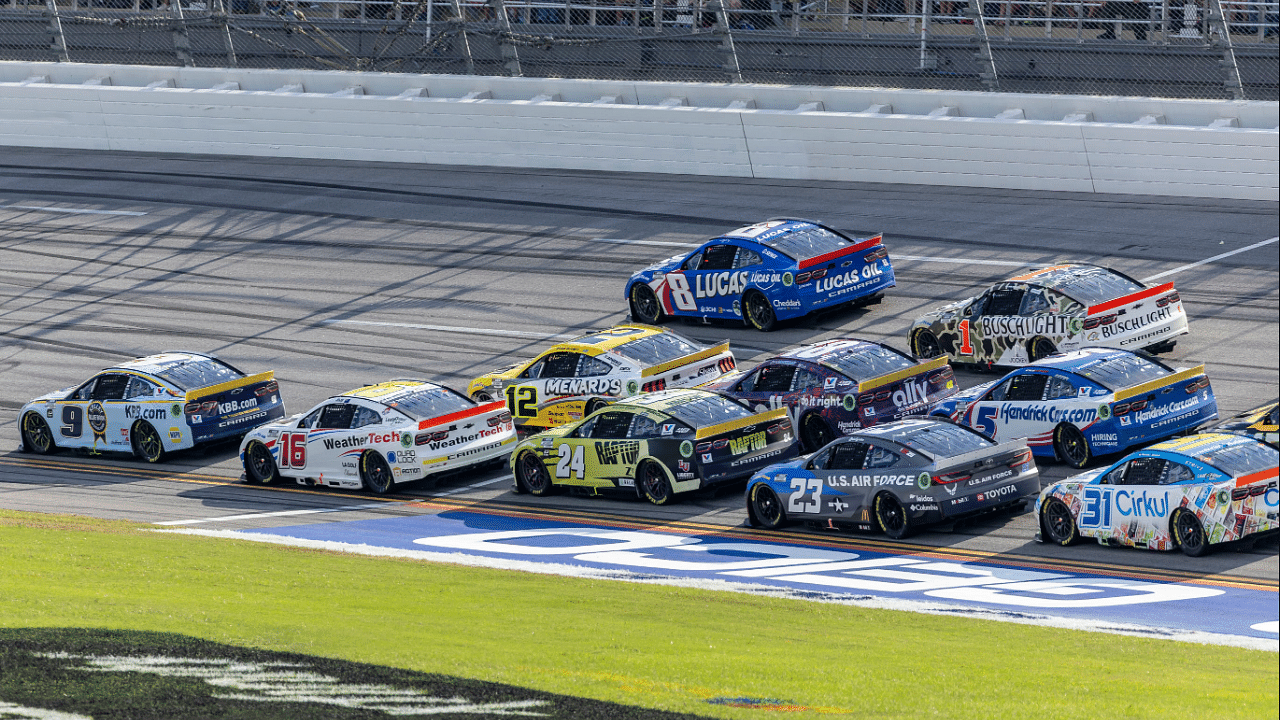 Oct 6, 2024; Talladega, Alabama, USA; Ryan Blaney (12) and Ross Chastain (1) are part of the lead pack seconds before their wreck in the final laps during the second stage of the YellaWood 500 at Talladega Superspeedway. Mandatory Credit: Vasha Hunt-Imagn Images