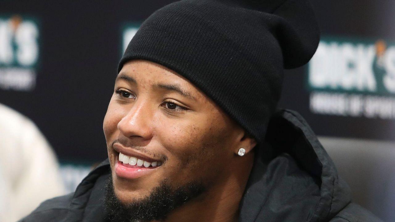 agles running back Saquon Barkley smiles as he poses for photos while making an autograph signing appearance to promote the opening of the Dick's House of Sport store at the Brandywine Town Center.