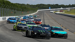 NASCAR Cup Series driver Denny Hamlin (11) races to the inside of driver Ty Gibbs (54) during The Great American Getaway 400 at Pocono Raceway.