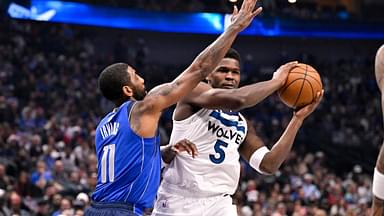 Minnesota Timberwolves guard Anthony Edwards (5) looks to pass the ball past Dallas Mavericks guard Kyrie Irving (11) during the first quarter at the American Airlines Center