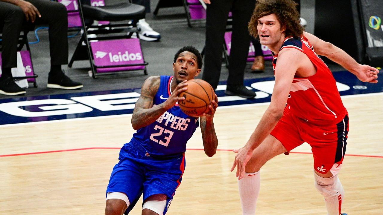 LA Clippers guard Lou Williams (23) makes move to the basket pass Washington Wizards center Robin Lopez (15) during the seance half at Capital One Arena