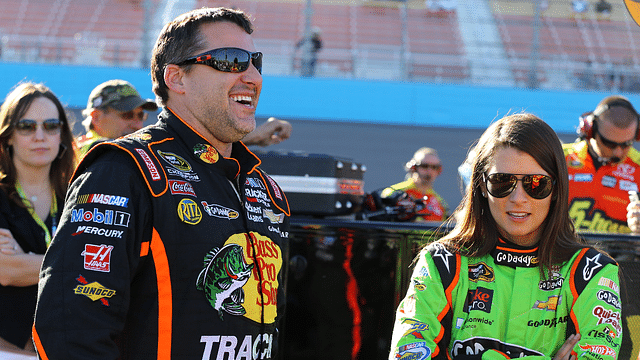 NASCAR Sprint Cup Series driver Tony Stewart (left) talks to teammate Danica Patrick during qualifying for the Subway Fresh Fit 500 at Phoenix International Raceway.